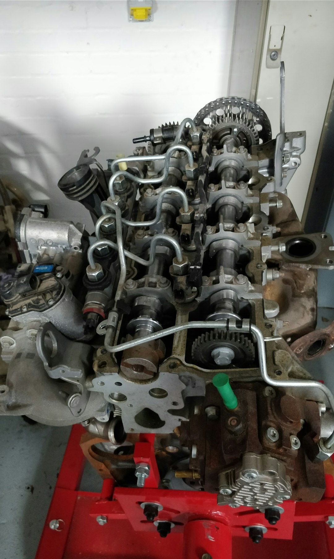 a-large-engine-sitting-on-top-of-a-red-stand-0jcz7usnrnm